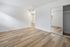 bedroom with wooden floors and mirror closet