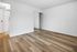 bedroom with wooden floors and mirror closet