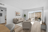 digitally enhanced living room with sofas and patio and wooden floor