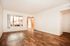 front door and living room with vinyl wood like flooring at Solaris on University