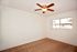 bedroom with brown carpet and ceiling fan at Solaris on University