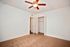 bedroom with brown carpet and ceiling fan and furnished and open closet at solaris on university