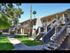 walkway and 2 story apartment building with stairs to second floor at Solaris on University