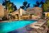 lit pool with lounge chairs at silver creek at night