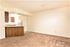 dining area and kitchen with brown carpet at silver creek apartments