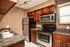 kitchen with granite counters and stainless steel appliances at Solaris at The Biltmore