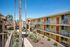 view of walkway in between two apartment buildings from second story at Solaris at The Biltmore