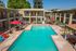 second story view of pool with lounge chairs and poolside cabana at Solaris at The Biltmore