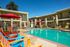 pool with colorful chairs and lounge chairs at Solaris at The Biltmore