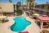second story view of pool with lounge chairs and poolside cabana at Solaris at The Biltmore