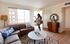 woman entering living room at oasis 20