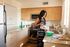 woman cooking on kitchen at Oasis 20
