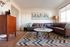 living room with brown sofa and coffee table and vinyl wood like flooring at Oasis 20