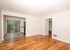 one bedroom living room with wood floors