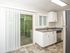 kitchen with stainless steel appliances, tile flooring, and patio door