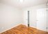 bedroom with closet and wood flooring