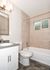 bathroom with soaking tub and window