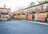 ample parking with lush landscaping