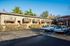 large parking lot with lush landscaping