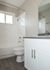 Bathroom with Grey Counters and Bathtub
