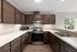Large window with stainless steel range and sink