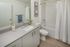 full bath with tub and vinyl wood like flooring and large vanity at twelve mile crossing