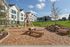 kids play area with wooden balance beams and wooden teepee at twelve mile crossing