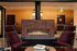 Apartments Downtown Portland, OR for Rent - ORO - Communal Lounge with Chairs, a Fireplace, and a Coffee Table