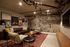 lounge area with leather sofa and arm chairs at oro apartments