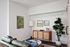 Downtown Portland, OR Apartments - ORO - Living Room with a Leather Sofa, Wood-Style Flooring, and Stylish Decor
