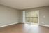large living space with wood floors and private patio