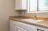 Kitchen with White Cabinets & Brown Counters