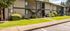 Exterior picture of apartment building with grass  areas