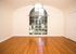 great room with wood floors and large window