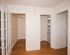 great room with wood floors and storage closets