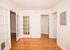 great room with wood floors and storage closets