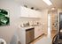 kitchen with stainless steel appliances and built in shelves