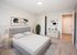 Carpeted bedroom with ample storage space