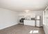 newly renovated kitchen with stainless steel appliances and modern wood style flooring