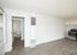 newly renovated kitchen with stainless steel appliances and modern wood style flooring
