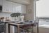 Kitchen with quartz countertops and stainless steel appliances