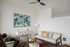 Living room with luxury vinyl plank flooring and ceiling fan