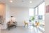dining area with round table and two yellow chairs at artisan