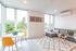 living room with grey sofa and white area rug at
