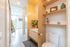 bathroom with white vanity and birch cabinets at artisan