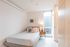 bedroom with bed and side table at artisan