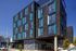 cross streets and exterior of 4 story parallax apartments building