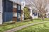 cement pathway in between grass and in front of a 2 story apartment building at redfield ridge