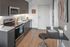 kitchen with stainless steel appliances and vinyl wood like flooring at aniva apartments