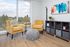 living room area with arm chairs and entertainment console at aniva apartments